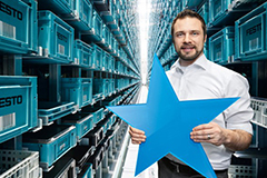 Employee in Festo warehouse with blue star in their hand